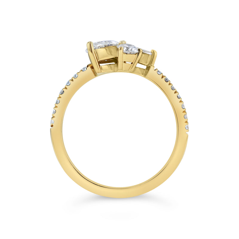 Front view. Mixed 3-diamond-cluster 18k engagement ring set into prongs slightly raised above the ring’s bridge. Small accent diamonds set evenly along the thin yellow gold band, running from either side of the gallery to the midpoint of the shank.